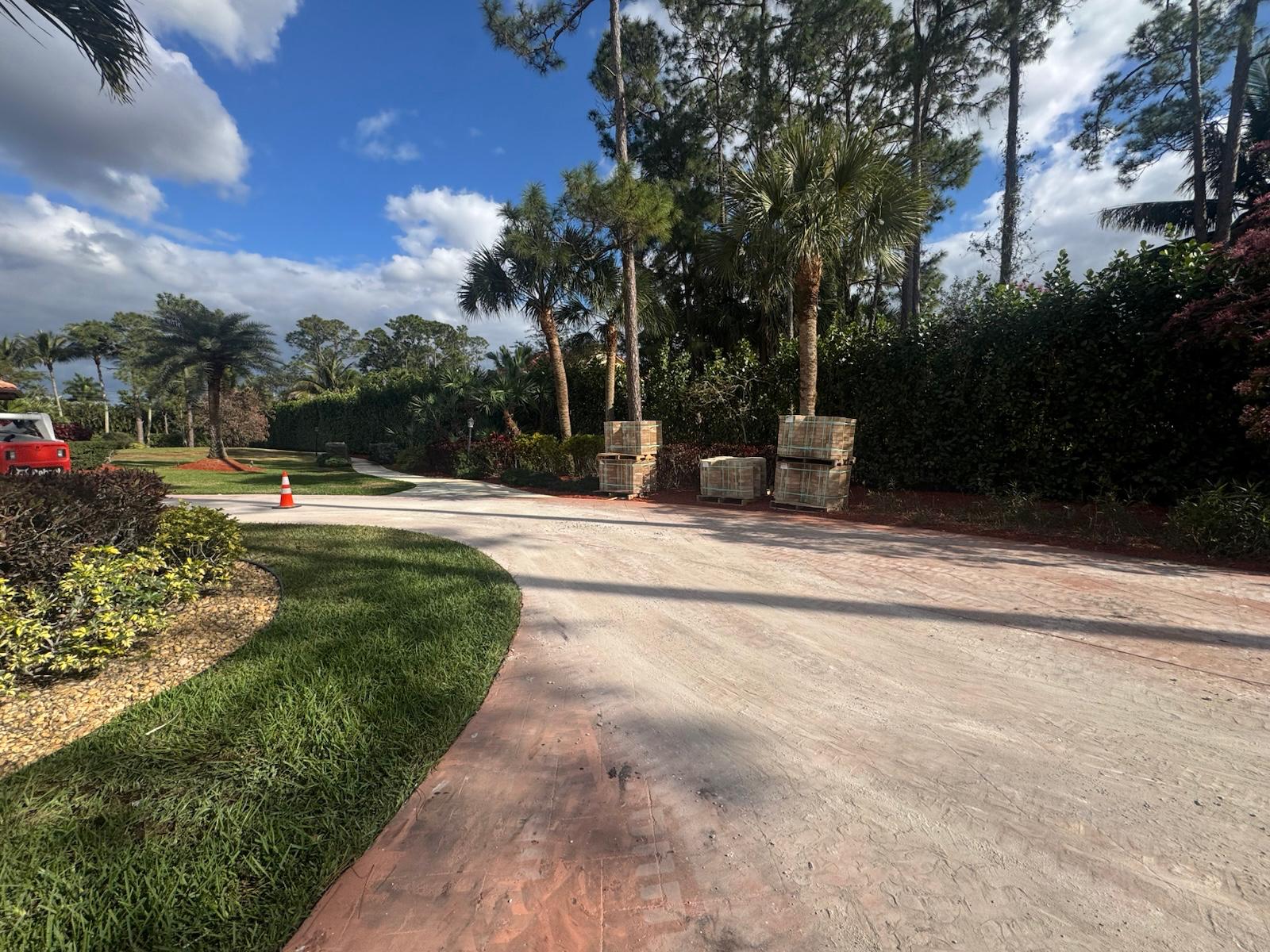 DMH Associates craftsmen installing brick pavers at a South Florida property